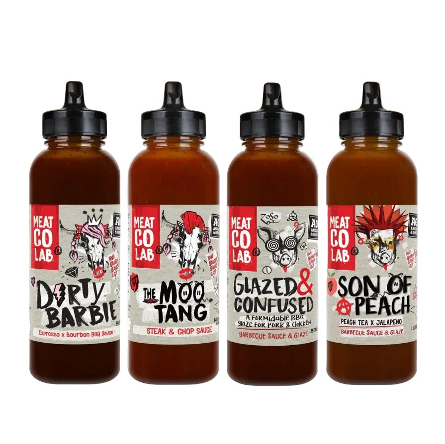 Four bottles of Meat Co Lab sauces with labels on a white background