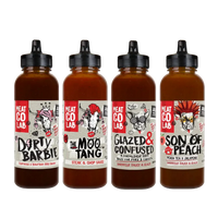 Four bottles of Meat Co Lab sauces with labels on a white background
