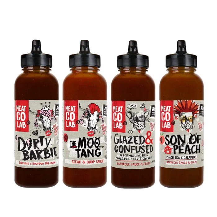 Four bottles of Meat Co Lab sauces with labels on a white background