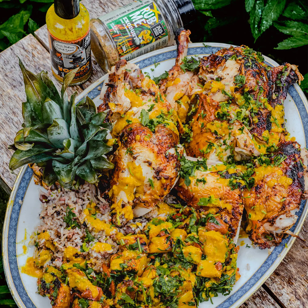 chicken with a mango and pineapple salsa made using angus & oink jerk seasoning an their voodoo mango sauce