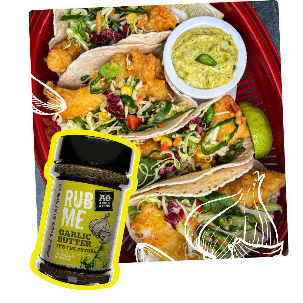fish tacos made using angus & oink garlic butter seasoning with a dip